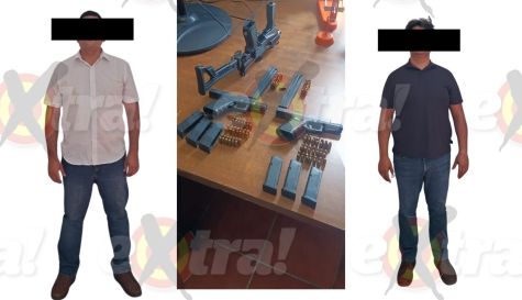 Escoltas detenidos con armas