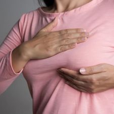 woman-checking-her-breast-for-early-signs-of-cancer.jpg